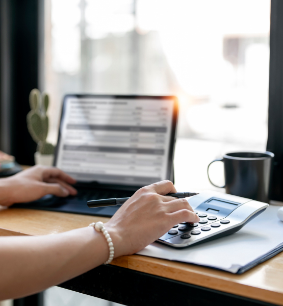person using loan calculator on laptop
