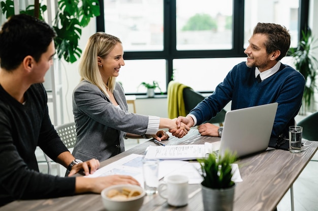 couple meeting financial advisor in office